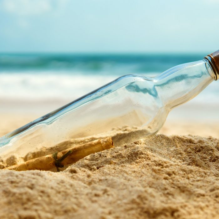 Message In A Bottle On The Shore Of A Desert Island